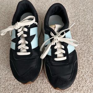 New Balance 237 women's sneaker in the black and bleach blue colorway